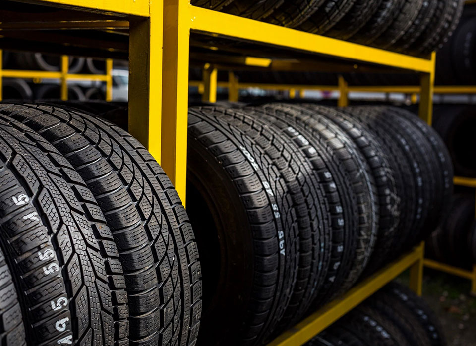 A rack of tires in the middle of a row.