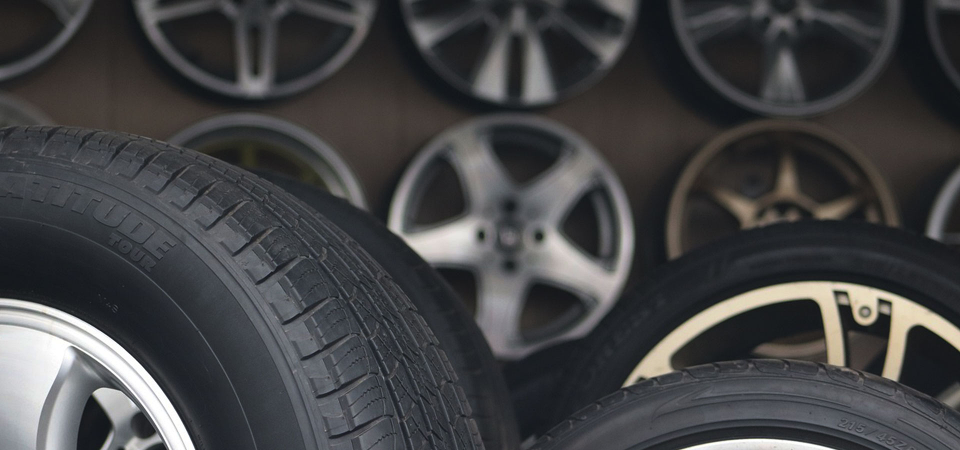 A close up of tires and wheels in front of other tires.